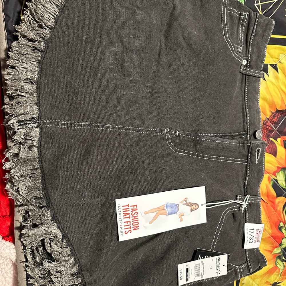 Black denim skirt. Size 17/33. Brand new with tags.